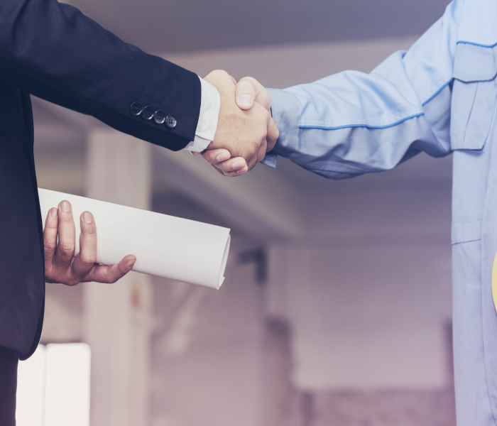 Architect engineer shaking hands with businessman on site, Teamwork cooperation success collaboration concept